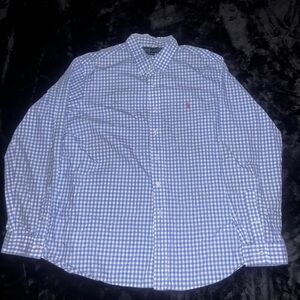 A blue and white button up polo shirt